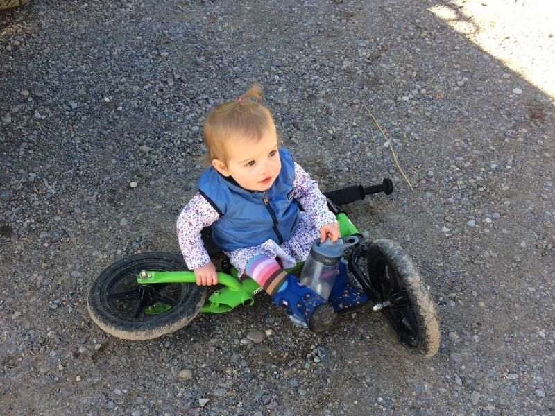 child struggles to ride a bike