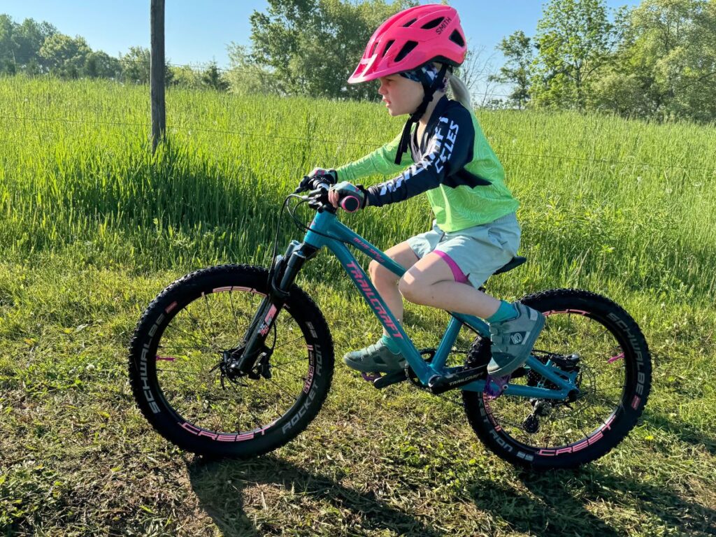 kidsbiketrailcraftbluesky A young girl rides a trailcraft bluesky 20" bike.