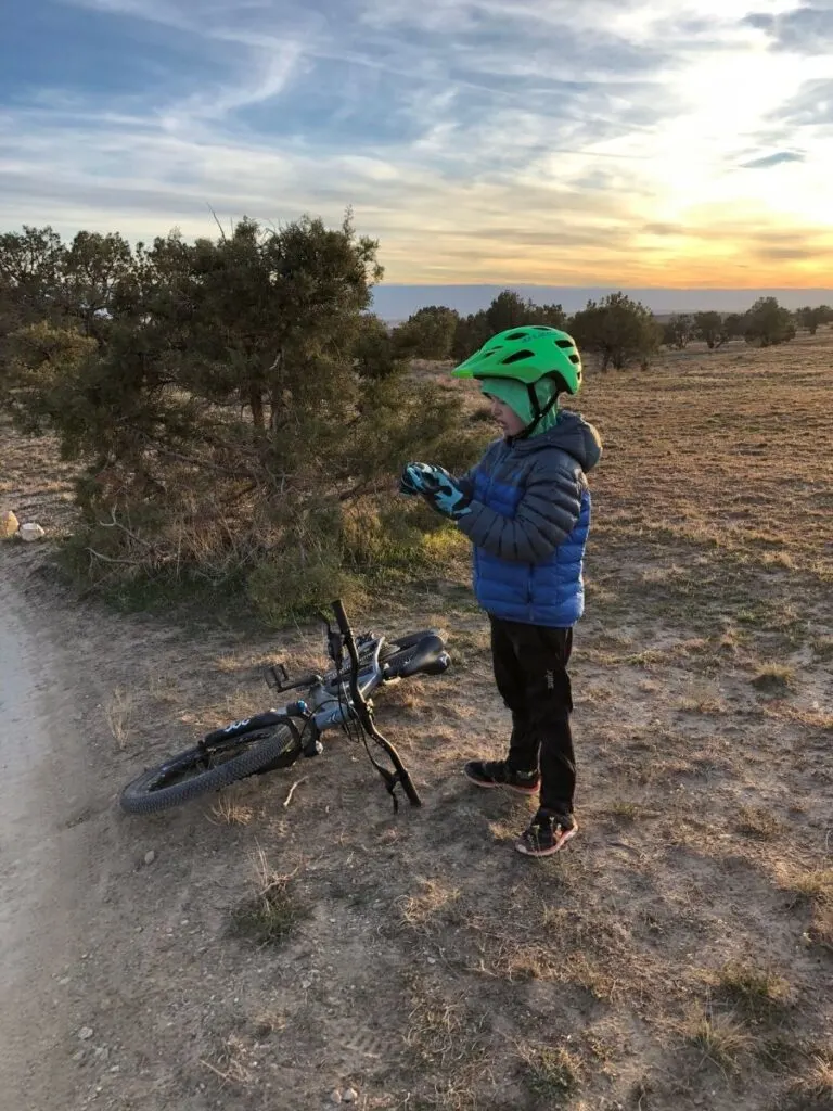 7 year old August putting on his gloves at the top of Kessel Run.