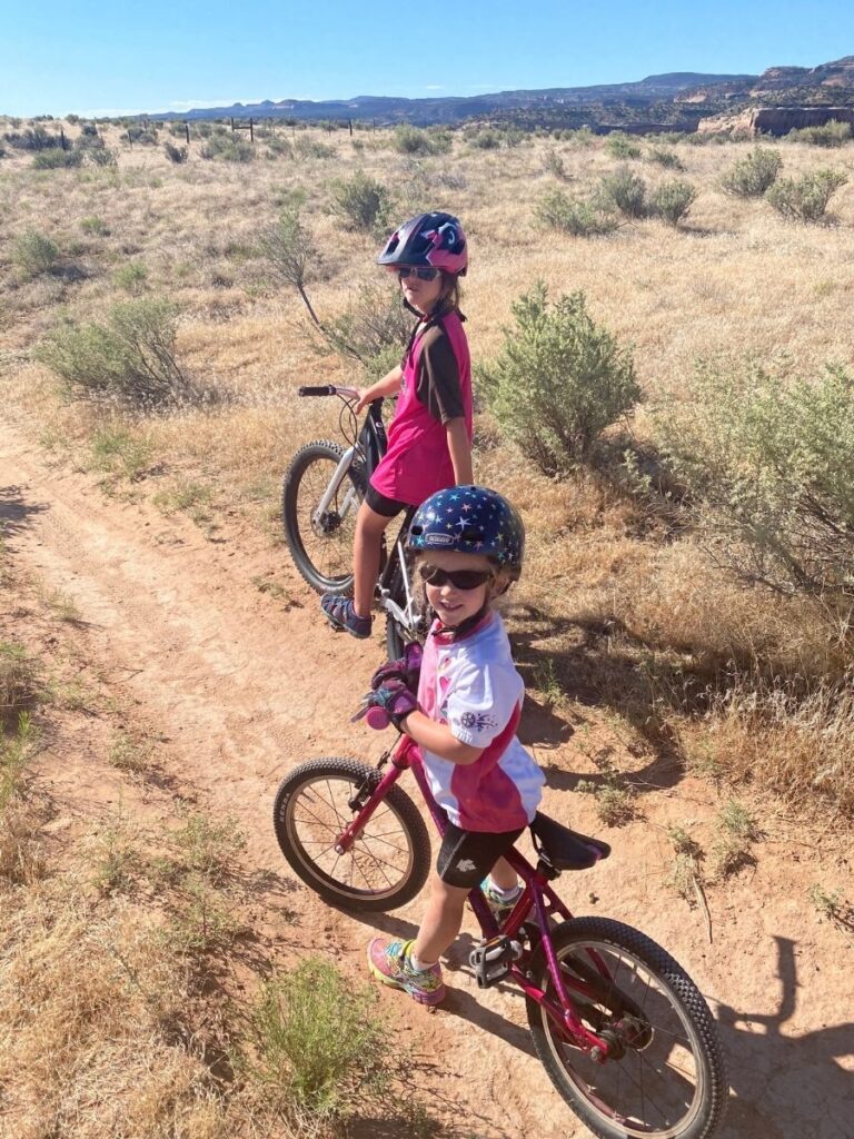 Sisters enjoying the sunshine on desert biking trails. 