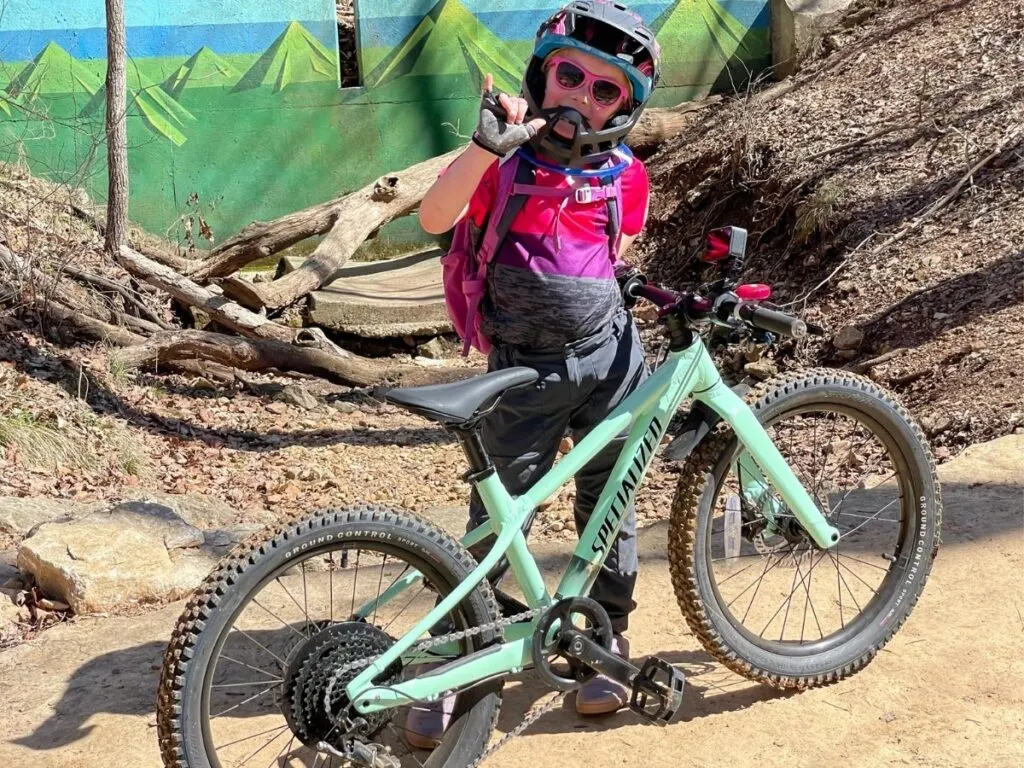 Girl standing next to her Specialized Riprock 20
