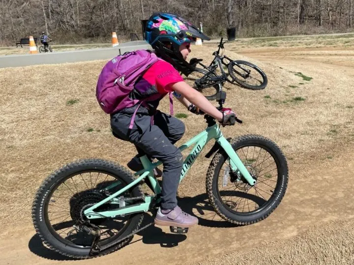 Girl riding her bike at a bike park