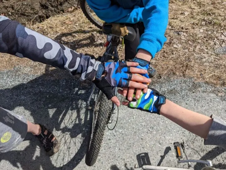 hands wearing bike gloves