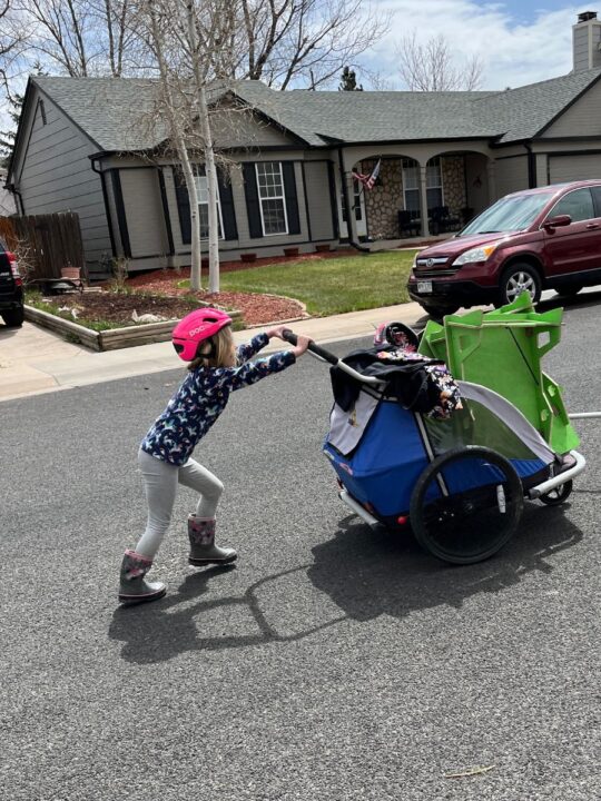 kid pushing cart with ramps