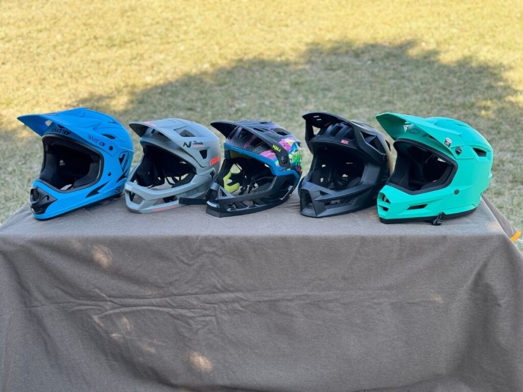 five full face helmets on display
