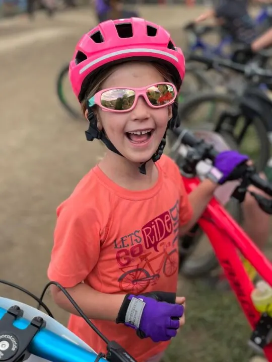 kid happy at bike race