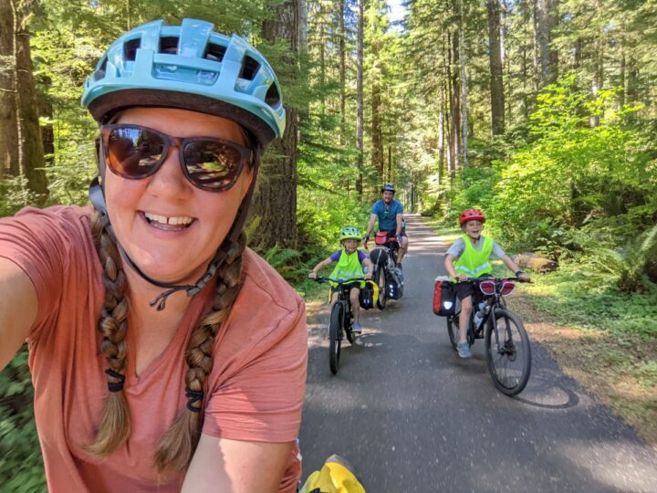 A family selfie while riding bikes.