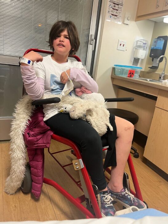 My eldest holding a stuffie in the er