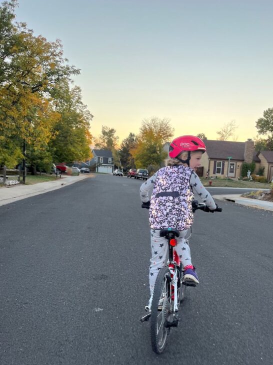 Reflective vest and helmet at dusk on my youngest.