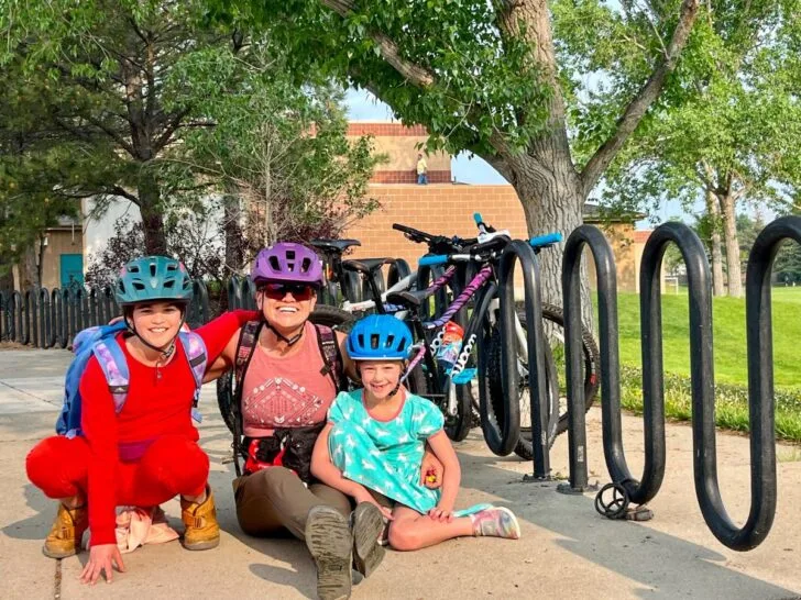 Myself and my kids on the last day of school in front of our bikes.