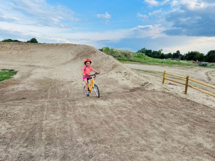 Happy smiles on pump track riding Woom Automagic