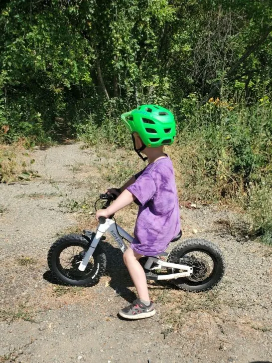 four year old on the dirt hero balance bike with 12 inch wheels