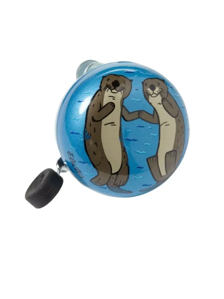A stock photo of a bike bell with two river otters on it 