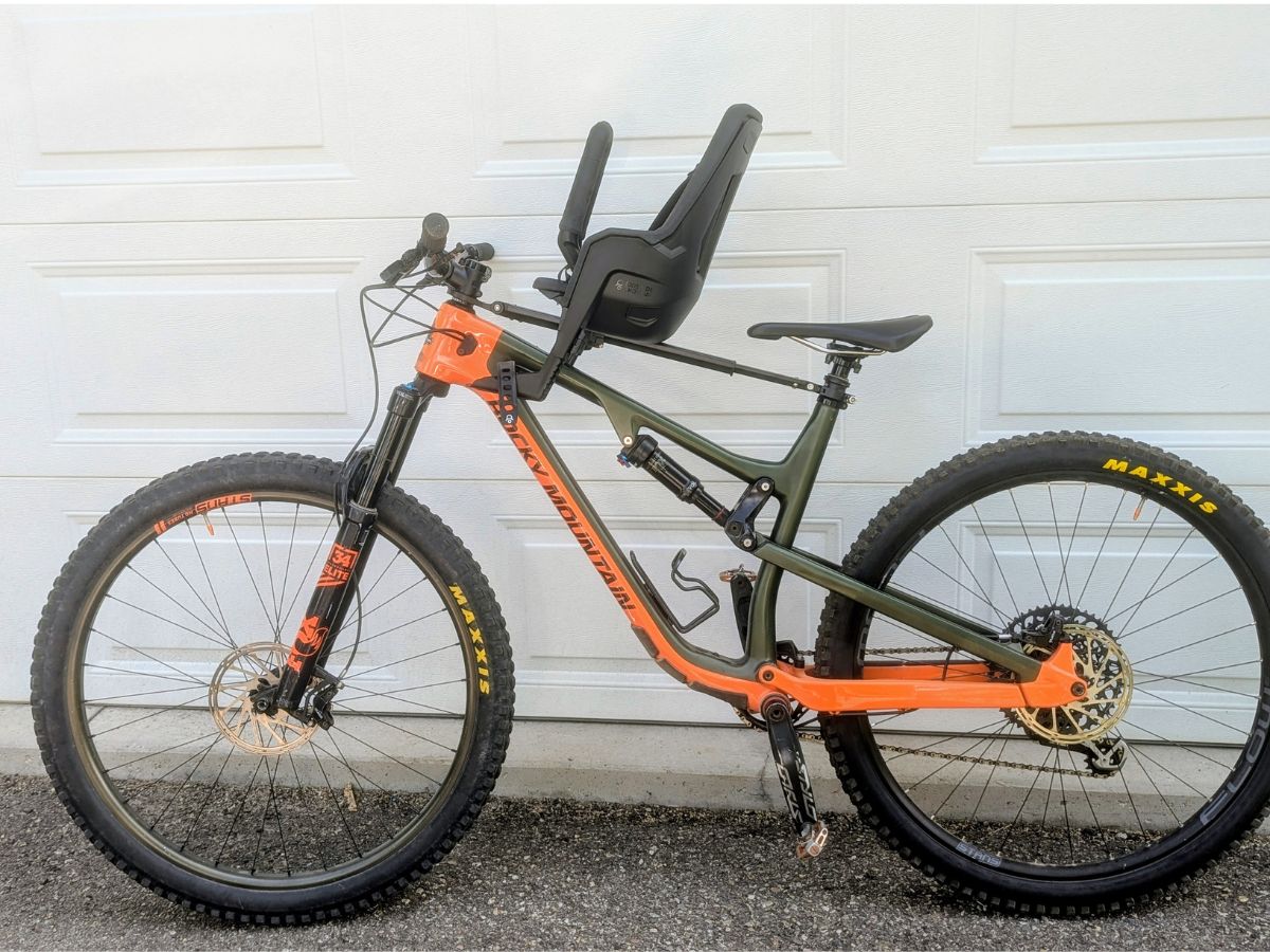 TMM and KRB Horizontal and Featured (34) A Kids Ride Shotgun Pro EVO seat mounted atop a mountain bike.