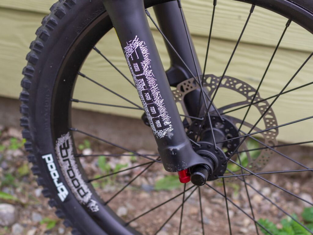 choosingkidsbikediscbrake Front tire and disc brake of a bike.